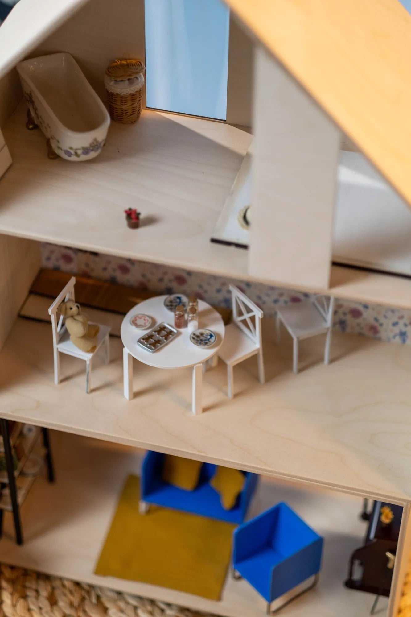 Classic open-front wooden dollhouse with multiple furnished rooms