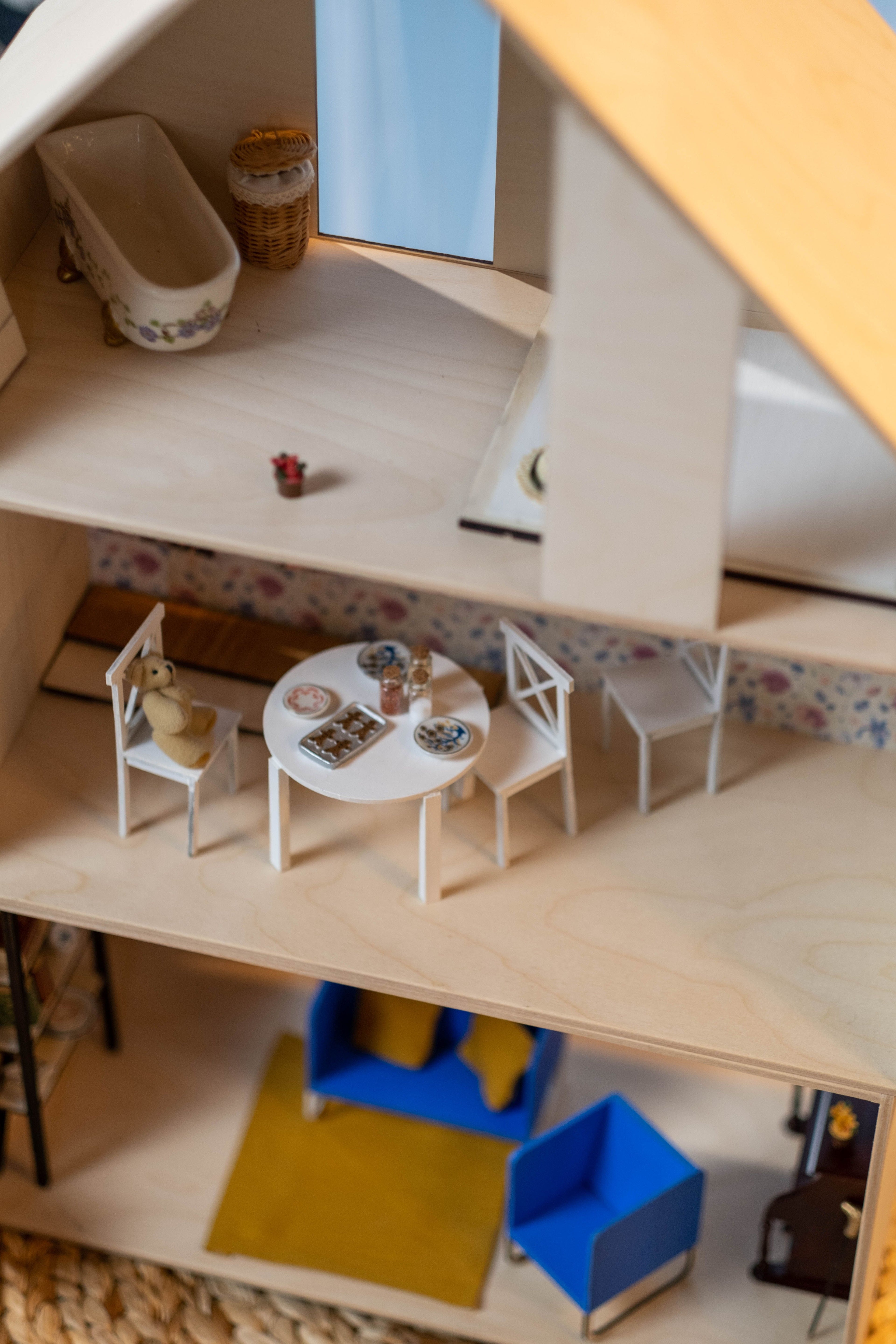 Classic open-front wooden dollhouse with multiple furnished rooms