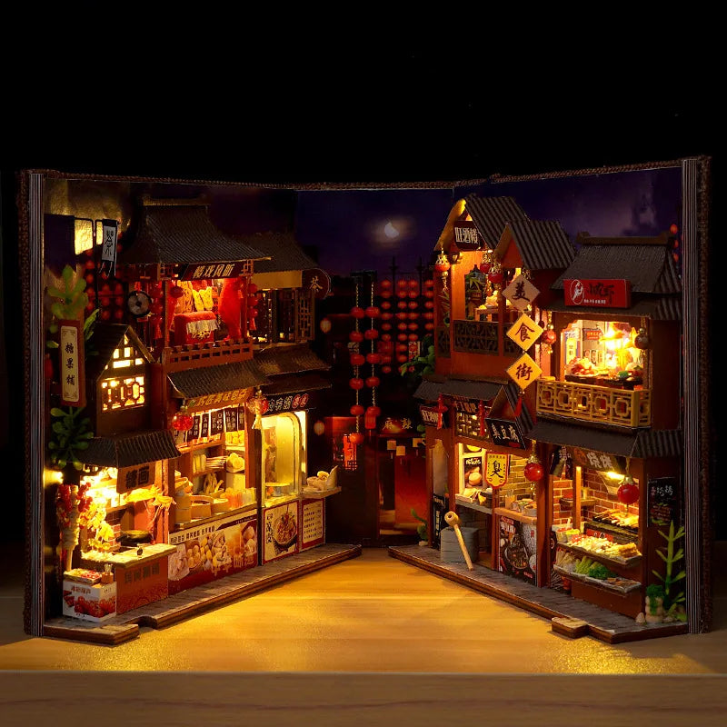 Night market street book nook kit open like a book, showing lit food stalls on both sides