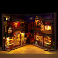 Night market street book nook kit open like a book, showing lit food stalls on both sides