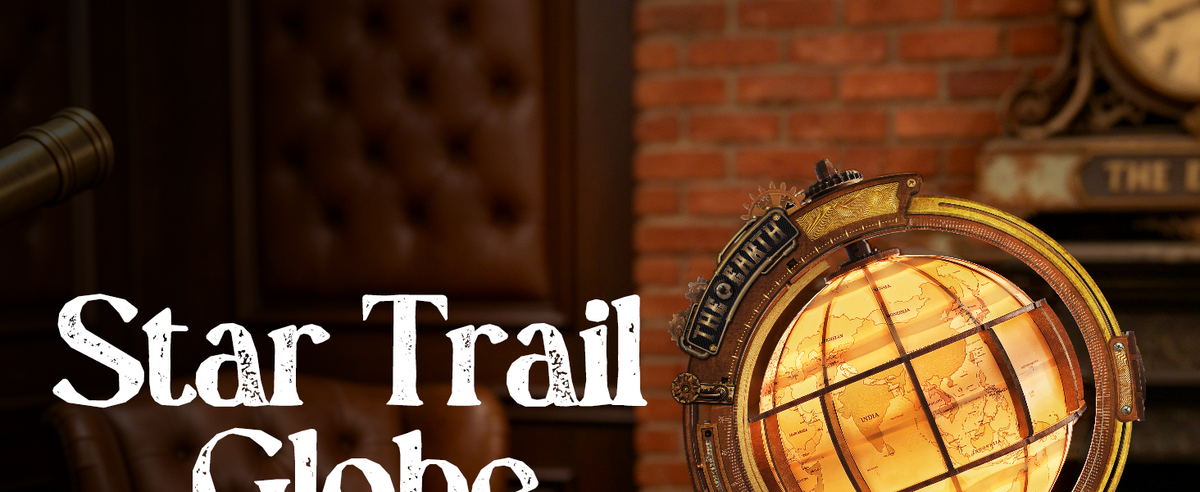 Star Trail Globe name plate close-up showing THE EARTH brass detailing