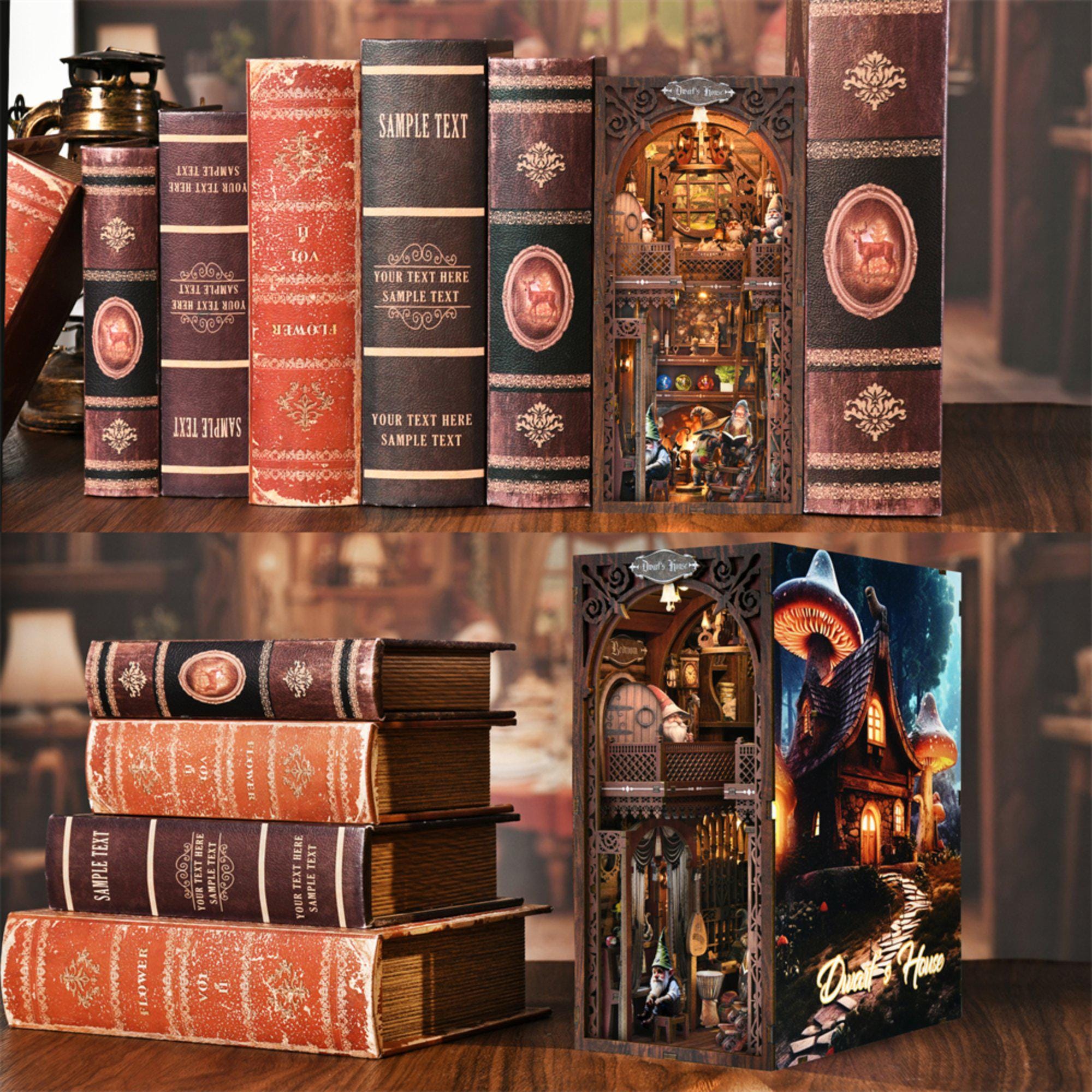 Snow White book nook kit used as a bookend between real books on a wooden shelf